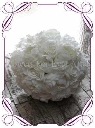 An elegant and romantic silk artificial white rose and peony bridal bouquet.