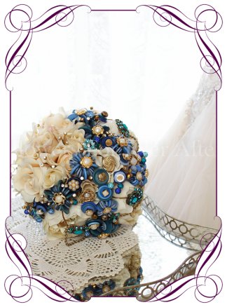 Blue button bouquet featuring a variation of button flowers exclusively designed in our studio this design also features button stacks in gold/pearl and blue aswell as gold cased diamantes and blue crystals on a vanilla silk rose and peony base. S