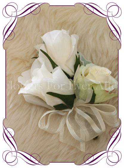 Ivory silk artificial roses in a classic design. An elegant corsage in a simple clean style. Made in Melbourne. Custom order. World wide shipping.