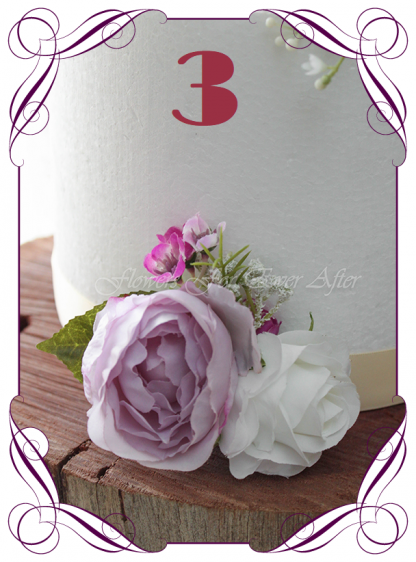 Silk artificial wedding cake ideas. Mixed purple lilac and white silk . Roses, peonies, baby's breath. Cadbury purple flowers. Made in Melbourne. Buy online. Shipping worldwide.