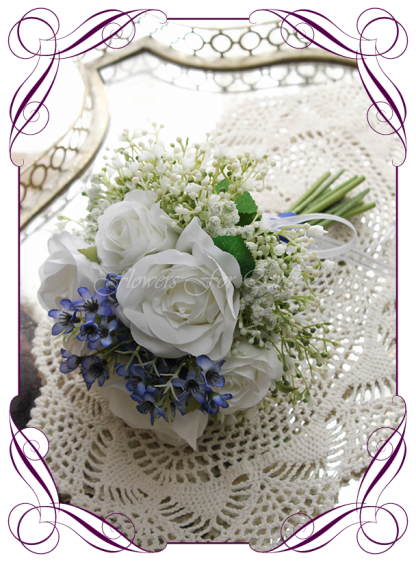 Silk artificial wedding bouquet ideas. Mixed ivory white and blue faux silk flowergirl bouquet wedding flowers. Roses, peonies, baby's breath. Elegant romantic wedding posy bouquet. Made in Melbourne. Buy online. Shipping worldwide.