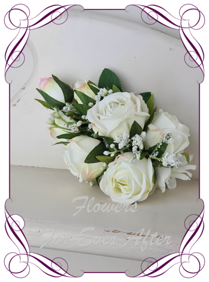 Silk artificial floral white ivory roses ladies corsage.. Roses, baby's breath, pinned or wrist corsage. Flowers for Mother of the bride, mother of the groom, formal, prom.. Made in Melbourne Australia. Buy online, post worldwide.