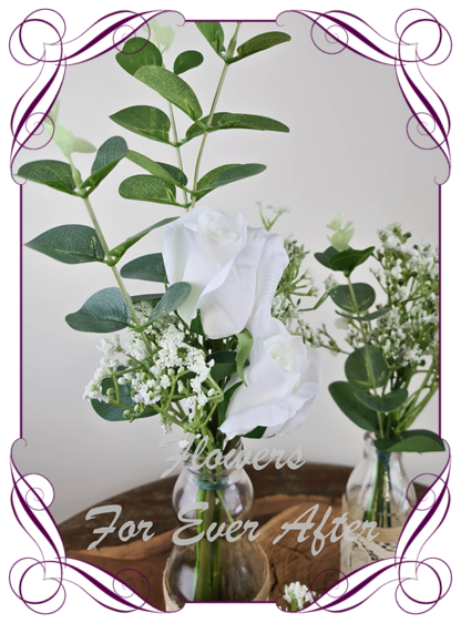 Silk artificial white roses and baby's breath and eucalypt gum bunch cluster table centrepiece decoration. Wedding table florals. simple white wedding rustic table centrepiece. Made in Australia. Buy online. Shipping world wide