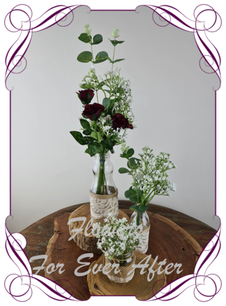 Silk artificial burgundy roses and baby's breath and eucalypt gum bunch cluster table centrepiece decoration. Wedding table florals. simple white wedding rustic table centrepiece. Made in Australia. Buy online. Shipping world wide