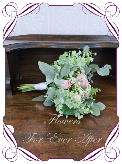 A Gorgeous Silk Artificial pastel and pink roses and Baby's Breath Bridal Bouquet posy, featuring faux flowers Australian native blue gum leaves in a romantic elegant and unusual bridal style, blush pink wedding flowers, native rustic wedding, boho flowers, traditional wedding bouquets. Made in Melbourne by Australia's Best Artificial Bridal Florist. Worldwide Shipping available