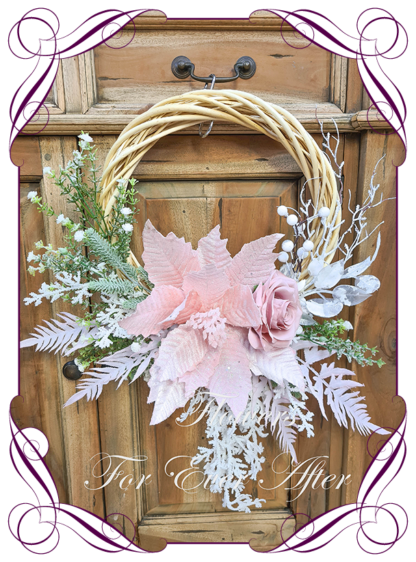 Pink White Artificial floral Christmas wreath for door or wall, featuring artificial pink poinsettias, silk roses and artificial foliage’s. Made by Melbourne’s Best Silk Bridal Florist creating unique artificial wedding flower packages. Delivery worldwide. Custom orders welcome.