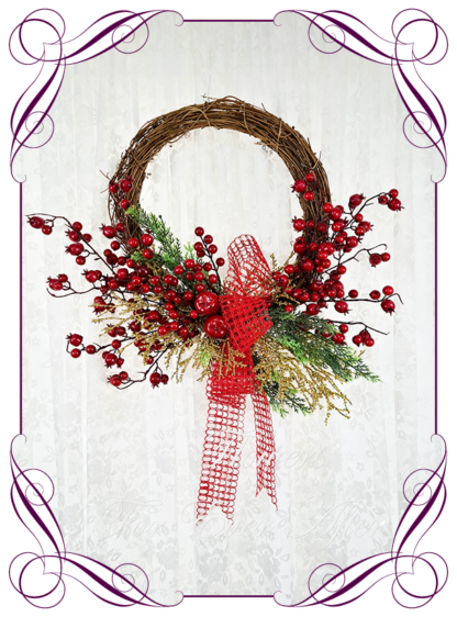 Red & Gold Artificial floral Christmas wreath for door or wall, featuring artificial red flowers and artificial foliage’s. Made by Melbourne’s Best Silk Bridal Florist creating unique artificial wedding flower packages. Delivery worldwide. Custom orders welcome.