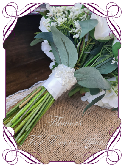 Silk artificial wedding bouquet ideas. Mixed ivory white faux silk bridal bouquet wedding flowers. Roses, peonies, ranunculus, baby's breath, eucalypt gum leaves foliage. Elegant romantic wedding posy bouquet. Made in Melbourne. Buy online. Shipping worldwide.