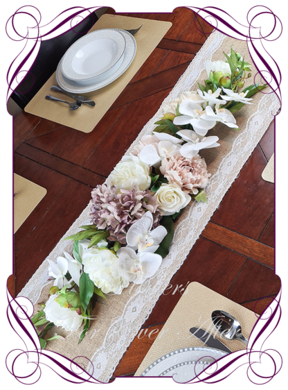 Silk artificial romantic bridal table centrepiece garland sign decoration garland nude champagne blush pink mauve peonies moth phalaenopsis orchids. Roses and orchid bridal wedding table arrangement centrepiece flowers. Realistic fake wedding flowers. Made in Melbourne Australia. Buy online..