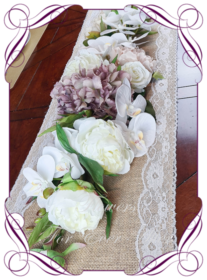Silk artificial romantic bridal table centrepiece garland sign decoration garland nude champagne blush pink mauve peonies moth phalaenopsis orchids. Roses and orchid bridal wedding table arrangement centrepiece flowers. Realistic fake wedding flowers. Made in Melbourne Australia. Buy online..