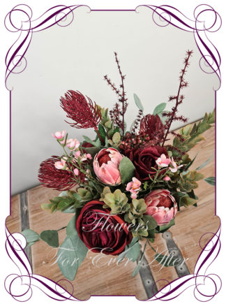 Silk artificial dark moody native Australian bridesmaid bouquet. Burgundy red and pink protea, berries, eucalypt. Made in Melbourne. Buy online. Shipping worldwide. Wedding bouquet ideas.