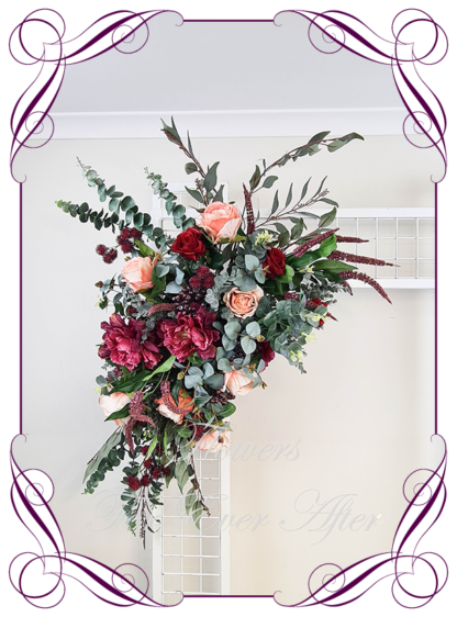 Silk artificial corner arbor wedding decoration florals. Burgundy and peach native and dark moody silk flowers. Made in Melbourne. Buy online. Arbor flowers. Sign flowers