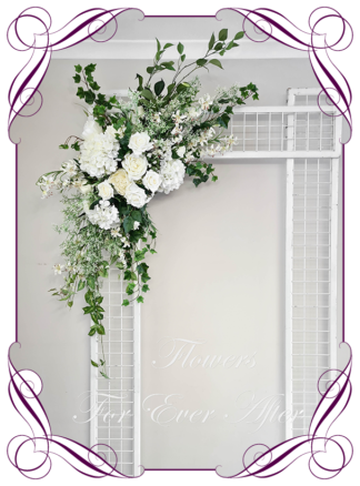 Silk artificial all white and foliage modern romantic wedding flowers wedding arbor arch background decoration. Hydrangea, white roses silk wedding florals, unusual romantic realistic fake wedding decoration design. Bridal table centrepiece flowers. Made in Melbourne Australia. Buy online..