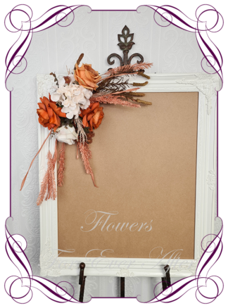 Silk artificial rust burnt orange cream and brown harvest rustic autumn fall sign board or pew decoration for wedding commitment ceremony. Silk flower centrepieces. Buy Online. Shipping world wide by Australia's best bridal florist.