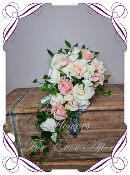 Silk artificial romantic classic elegant bridal tear bouquet in peach pink and white bridal flowers. Made in Melbourne Australia by Australia's best silk florist. Buy online. Shipping worldwide. Lux wedding florals. Luxe wedding flowers. Cheap wedding bouquets.