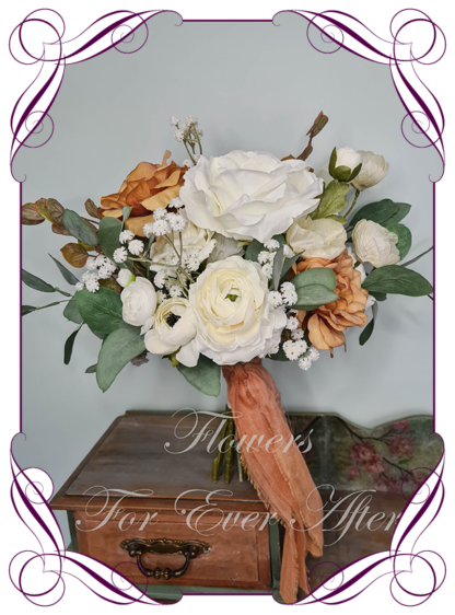 A Gorgeous Silk Artificial light burnt orange sepia white roses ranunculus and Baby's Breath Bridal Bouquet posy, featuring faux flowers Australian native sage green gum leaves in a romantic elegant and unusual bridal style, classic white wedding flowers, native rustic wedding, boho flowers, traditional wedding bouquets. Made in Melbourne by Australia's Best Artificial Bridal Florist. Worldwide Shipping available