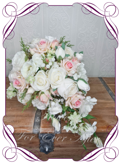 Silk artificial romantic classic elegant bridal tear bouquet in blush pink and white bridal flowers. Made in Melbourne Australia by Australia's best silk florist. Buy online. Shipping worldwide. Princess tear wedding florals. Realisitic fake wedding flowers. Cheap wedding bouquets.