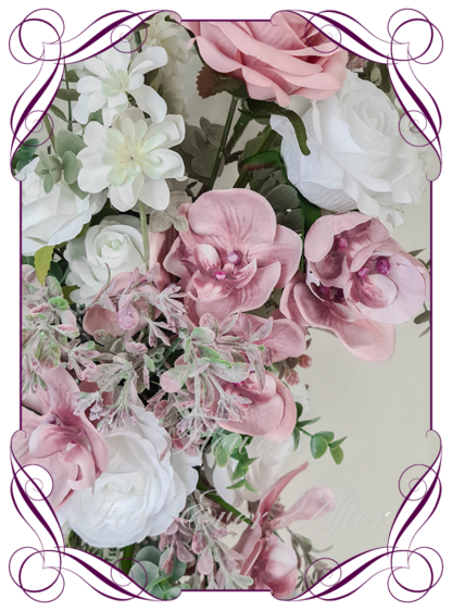 Wedding ceremony artificial flower décor for arbors, backdrop flowers. Featuring faux flowers in dusty pink, white and Australian native foliage. Silk orchids and roses in a classy arbor decoration for easy set up. Made in Melbourne Australia. Buy Online Now.
