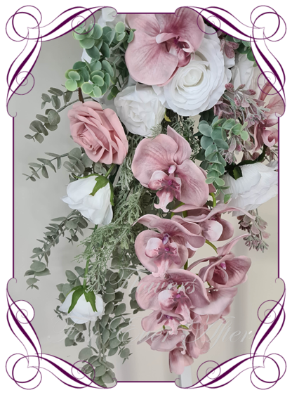 Wedding ceremony artificial flower décor for arbors, backdrop flowers. Featuring faux flowers in dusty pink, white and Australian native foliage. Silk orchids and roses in a classy arbor decoration for easy set up. Made in Melbourne Australia. Buy Online Now.