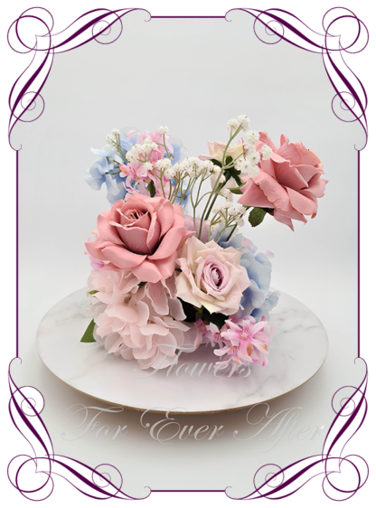 Silk faux dusty blue, blush pink and mauve lavender table centrepiece decoration flowers. Wedding table florals. Baby shower table decorations. Luxe romantic wedding table centrepiece with roses, peonies, hydrangea. Affordable table decoration flowers. Made in Australia. Buy online. Shipping world wide.