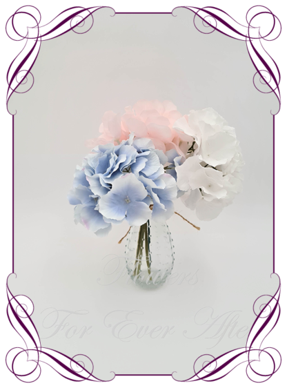Silk faux dusty blue, blush pink and mauve lavender table centrepiece decoration flowers. Wedding table florals. Baby shower table decorations. Luxe romantic wedding table centrepiece with roses, peonies, hydrangea. Affordable table decoration flowers. Made in Australia. Buy online. Shipping world wide.