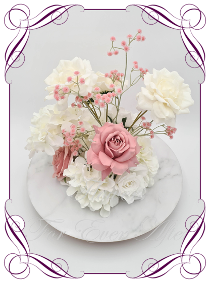 Silk faux ivory, white, pink, dusty pink table centrepiece decoration flowers. Wedding table florals. Shower table decorations. Luxe romantic wedding table centrepiece with roses, babys's breath, hydrangea. Affordable table decoration flowers. Made in Australia. Buy online. Shipping world wide.