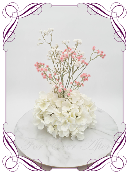 Silk faux ivory, pink and white table centrepiece decoration flowers. Wedding table florals. Shower table decorations. Luxe romantic wedding table centrepiece with roses, babys's breath, hydrangea. Affordable table decoration flowers. Made in Australia. Buy online. Shipping world wide.