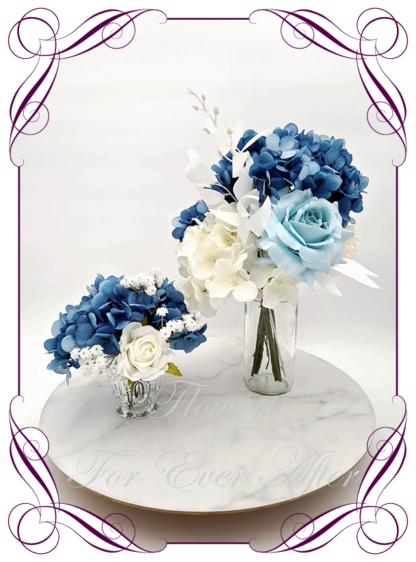 Silk artificial sapphire blue and white table centrepiece decoration flowers. Wedding table florals. Shower table decorations. Luxe rustic romantic wedding table centrepiece with roses, babys's breath, and hydrangea. Affordable table decoration flowers. Made in Australia. Buy online. Shipping world wide.