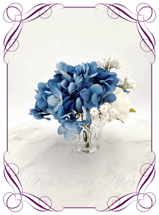 Silk artificial sapphire blue and white table centrepiece decoration flowers. Wedding table florals. Shower table decorations. Luxe rustic romantic wedding table centrepiece with roses, babys's breath, and hydrangea. Affordable table decoration flowers. Made in Australia. Buy online. Shipping world wide.