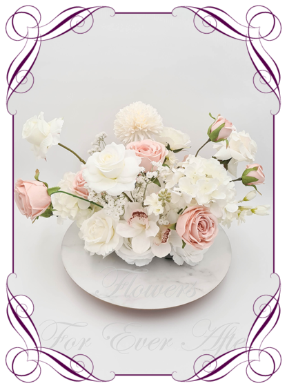 Silk faux ivory, white, blush dusty pink table centrepiece decoration flowers. Wedding table florals. Shower table decorations. Luxe romantic wedding table centrepiece with roses, babys's breath, orchids, hydrangea. Affordable table decoration flowers. Made in Australia. Buy online. Shipping world wide.
