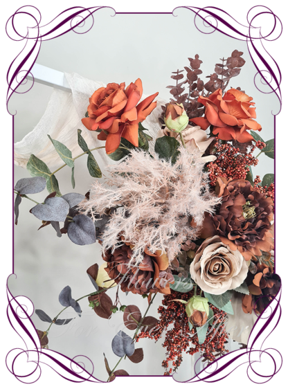 Silk Wedding ceremony arbour flowers package in artificial rust orange and brown Autumn arbor florals. Décor for wedding ceremony backdrop decoration. Faux Roses, pampas, and palm. Buy online now. Shipping world wide. Cheap wedding arbor decoration ideas.