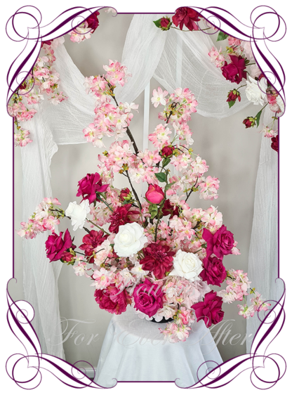 Silk Wedding ceremony arbour and floor arrangement flowers package in artificial luxe fuchsia pink, blush, hot pink, and white faux florals. Décor for wedding ceremony backdrop decoration. Faux Roses, blossoms, hydrangea. Buy online now. Shipping world wide. Cheap wedding arbor decoration ideas. Barbie wedding party decoration flowers