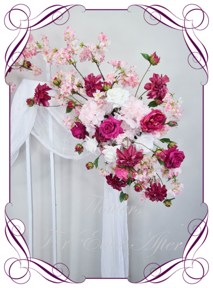 Silk Wedding ceremony arbour and floor arrangement flowers package in artificial luxe fuchsia pink, blush, hot pink, and white faux florals. Décor for wedding ceremony backdrop decoration. Faux Roses, blossoms, hydrangea. Buy online now. Shipping world wide. Cheap wedding arbor decoration ideas. Barbie wedding party decoration flowers