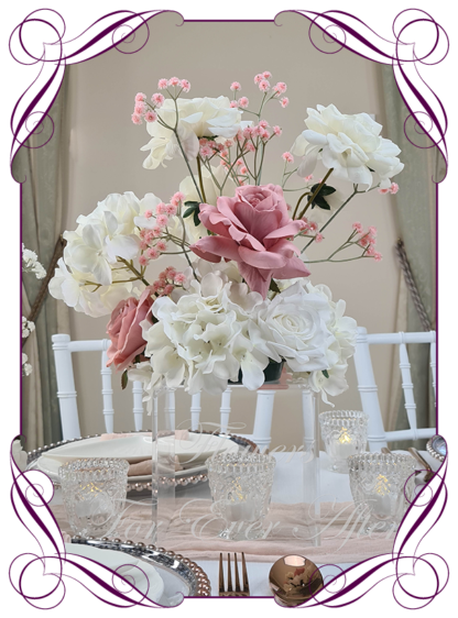 Silk faux ivory, white, pink, dusty pink table centrepiece decoration flowers. Wedding table florals. Shower table decorations. Luxe romantic wedding table centrepiece with roses, babys's breath, hydrangea. Affordable table decoration flowers. Made in Australia. Buy online. Shipping world wide.