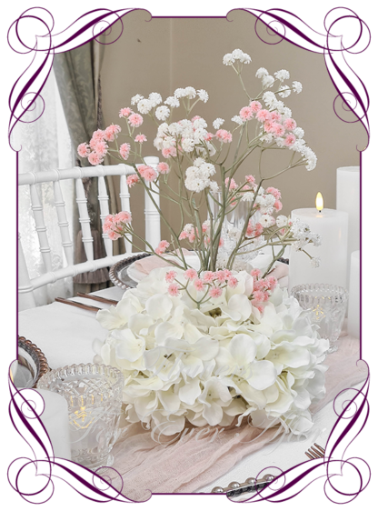 Silk faux ivory, pink and white table centrepiece decoration flowers. Wedding table florals. Shower table decorations. Luxe romantic wedding table centrepiece with roses, babys's breath, hydrangea. Affordable table decoration flowers. Made in Australia. Buy online. Shipping world wide.