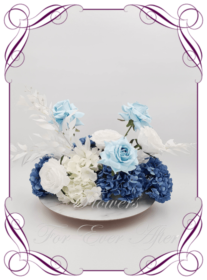 Silk artificial sapphire blue and white table centrepiece decoration flowers. Wedding table florals. Shower table decorations. Luxe rustic romantic wedding table centrepiece with roses, and hydrangea. Affordable table decoration flowers. Made in Australia. Buy online. Shipping world wide.