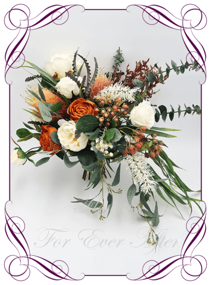 Silk Bridal Bouquet in realistic rust burnt orange, green leaves, and ivory, native faux flowers. Bridal posy, featuring artificial roses, bottle brush, banksia, peony, lily of the valley flowers in a romantic rustic and unusual bridal style modern rustic wedding bouquets. Made in Melbourne by Australia's Best Artificial Bridal Florist. Buy online now. Worldwide Shipping available