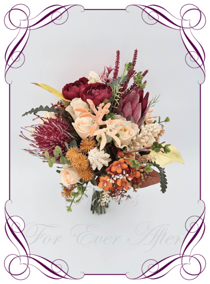 Silk Bridal Bouquet in realistic burgundy, peach and cream native faux flowers. Bridal posy, featuring artificial roses, protea, banksia, kangaroo paw, ranunculus flowers in a romantic elegant and unusual bridal style modern rustic wedding bouquets. Made in Melbourne by Australia's Best Artificial Bridal Florist. Buy online now. Worldwide Shipping available