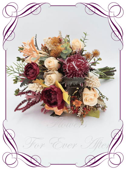 Silk Bridal Bouquet in realistic burgundy, peach and cream native faux flowers. Bridal posy, featuring artificial roses, protea, banksia, kangaroo paw, ranunculus flowers in a romantic elegant and unusual bridal style modern rustic wedding bouquets. Made in Melbourne by Australia's Best Artificial Bridal Florist. Buy online now. Worldwide Shipping available