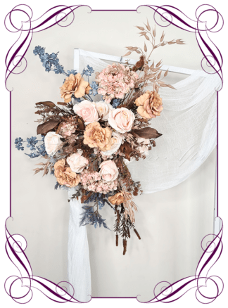 Silk artificial wedding arbor florals in an artistic renaissance colour theme. Realistic blush, peach, dusty blue, dusty pink, mustard toffee gold, brown, and cream faux flowers. Ceremony flowers, featuring artificial roses, hydrangea, peonies, wild flowers in a romantic elegant and unusual bridal style modern rustic ceremony arrangement. Made in Melbourne by Australia's Best Artificial Bridal Florist. Buy online now. Worldwide Shipping available