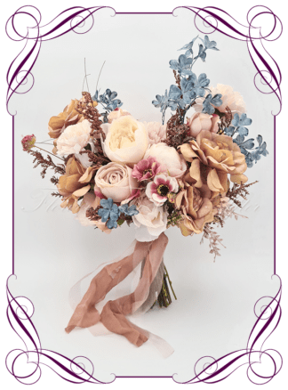 Silk Bridal Bouquet in an artistic renaissance colour theme. Realistic blush, peach, dusty blue, dusty pink, mustard toffee gold, brown, and cream faux flowers. Bridal posy, featuring artificial roses, carnations, peonies, wild flowers in a romantic elegant and unusual bridal style modern rustic wedding bouquets. Made in Melbourne by Australia's Best Artificial Bridal Florist. Buy online now. Worldwide Shipping available