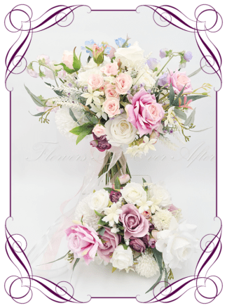 Whilsical romantic silk artificial pastel blue, lilac, lavender, white and pink Spring style bridal bouquet wedding flowers, including roses, ranunculus, chyrsanthemum, sweetpea, stephanotis, and native Australian gum foliage. Romantic wedding. Navy wedding. Pink wedding. Lilac wedding. Blush wedding. Spring wedding. Realistic silk flowers, modern whimsical style posy. Made in Melbourne. Shipping world wide, buy online.
