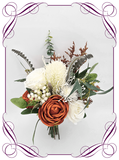Silk Bridal Bouquet in realistic rust burnt orange, green leaves, and ivory, native faux flowers. Bridal posy, featuring artificial roses, native banksia, leucosperum, peony, in a romantic rustic and unusual bridal style modern rustic wedding bouquets. Made in Melbourne by Australia's Best Artificial Bridal Florist. Buy online now. Worldwide Shipping available