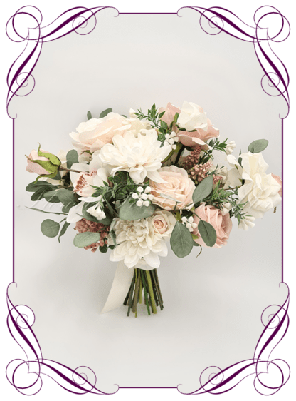Artificial Bridal flowers in faux blush pink, and white roses with gum natives. Silk Bridesmaids Bouquet posy, featuring faux flowers Australian native sage green gum leaves in a romantic elegant and unusual bridal style, classic white and blush pink wedding flowers, native rustic wedding, boho flowers, traditional wedding bouquets. Made in Melbourne by Australia's Best Artificial Bridal Florist. Buy now Online. Worldwide Shipping available