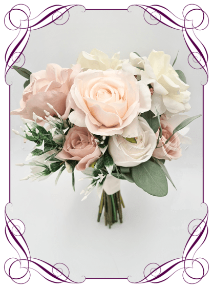 Artificial Bridesmaids flowers in faux blush pink, and white roses with gum natives. Silk Bridesmaids Bouquet posy, featuring faux flowers Australian native sage green gum leaves in a romantic elegant and unusual bridal style, classic white and blush pink wedding flowers, native rustic wedding, boho flowers, traditional wedding bouquets. Made in Melbourne by Australia's Best Artificial Bridal Florist. Buy now Online. Worldwide Shipping available
