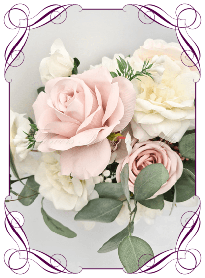 Artificial Bridal flowers in faux blush pink, and white roses with gum natives. Silk Bridesmaids Bouquet posy, featuring faux flowers Australian native sage green gum leaves in a romantic elegant and unusual bridal style, classic white and blush pink wedding flowers, native rustic wedding, boho flowers, traditional wedding bouquets. Made in Melbourne by Australia's Best Artificial Bridal Florist. Buy now Online. Worldwide Shipping available