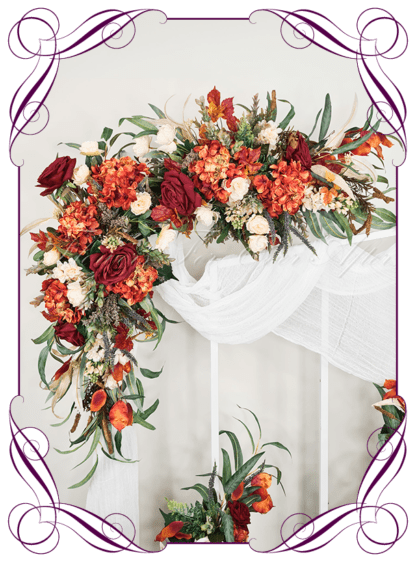 Wedding Ceremony Silk arbor flowers. Artificial red burgundy, orange, cream, and sage green arbor florals decoration, for wedding ceremony backdrop decoration. Hydrangea, roses, peonies, native gum eucalypt foliage. Buy online now. Shipping world wide. Cheap wedding arbor decoration ideas.