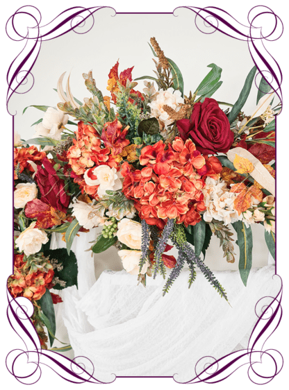Wedding Ceremony Silk arbor flowers. Artificial red burgundy, orange, cream, and sage green arbor florals decoration, for wedding ceremony backdrop decoration. Hydrangea, roses, peonies, native gum eucalypt foliage. Buy online now. Shipping world wide. Cheap wedding arbor decoration ideas.