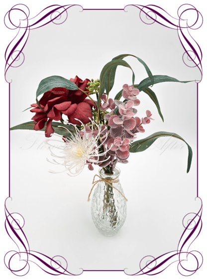 Silk faux burgundy and cream table centrepiece decoration flowers. Wedding table florals. Shower table decorations. Luxe rustic romantic wedding table centrepiece with rose, Australian natives, and eucalypt. Cheap wedding table decoration flowers. Made in Australia. Buy online. Shipping world wide.