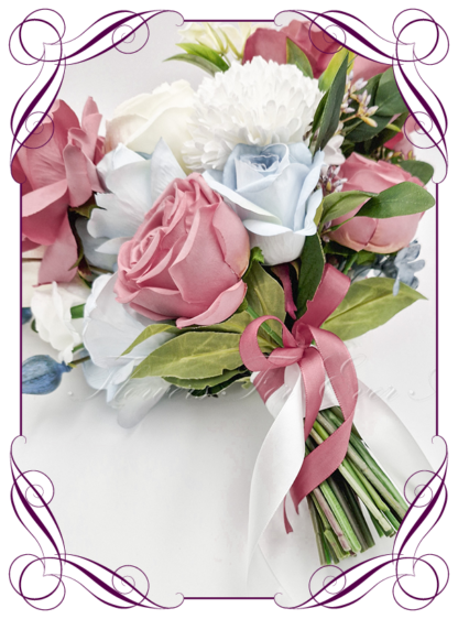 Artificial Bridal flowers in white, light dusty blue, and dusty pink flowers, with green foliage. Silk wedding Bouquet posy, featuring faux flowers in a romantic elegant and unusual bridal style, modern white, dusty pink and dusty blue luxe and green wedding flowers, rustic wedding, boho flowers, traditional wedding bouquets. Made in Melbourne by Australia's Best Artificial Bridal Florist. Buy now Online. Worldwide Shipping available
